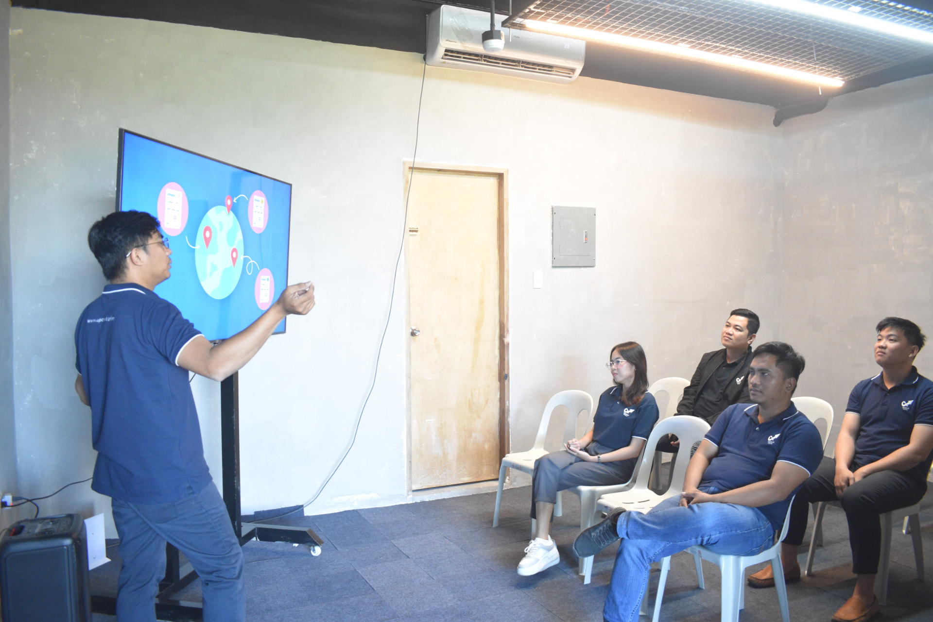 Team member presenting workflow ideas on a screen